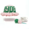 Pink AKA crochet bucket hat with ruffle brim and green 1908 detail