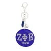 Zeta Phi Beta rhinestone keychain with blue padded charm and tassel