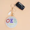 OES Keychain – White Padded Rhinestone Bag Charm with Tassel - Image 2